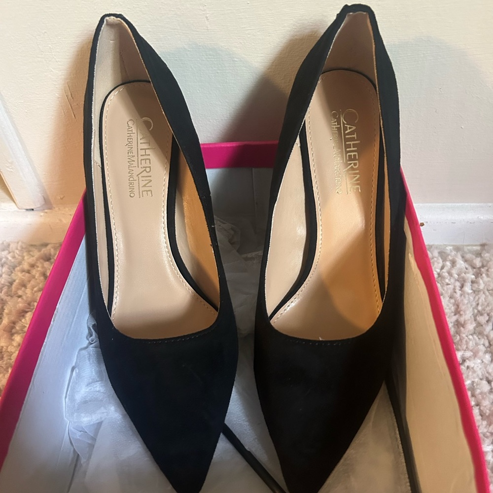 Black suede pumps